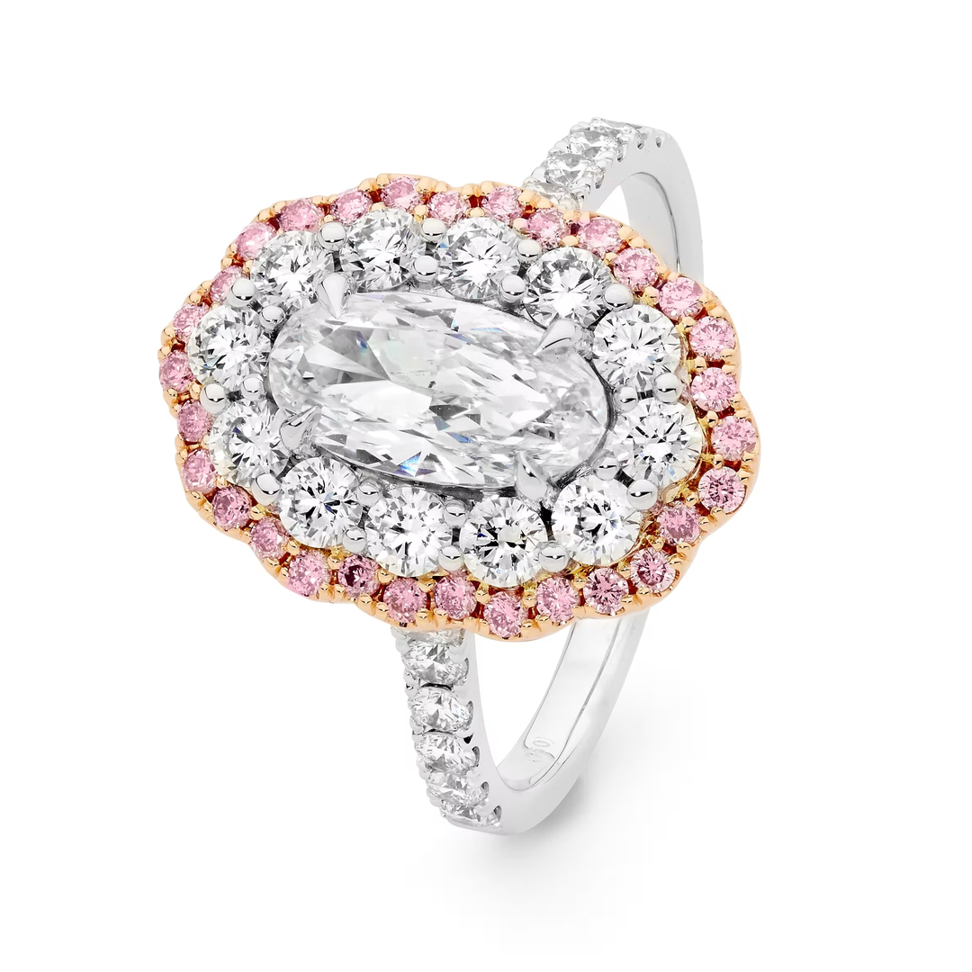 An oval halo ring featuring a large marquise-cut clear center stone surrounded by double rows of round and oval clear stones, with a border of small pink stones and rose gold settings, on a white background.