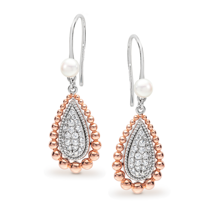 The Grace Earrings are a timeless essential, designed to bring effortless elegance to everyday wear. Featuring classic hook settings accented with sparkling cubic zirconia and finished with a luminous pearl, these refined earrings beautifully balance simplicity and sophistication. A versatile staple for any fine jewellery collection, the Grace Earrings offer enduring style with a polished, graceful finish.