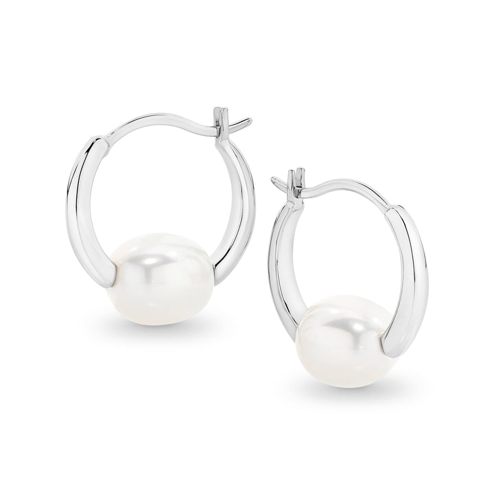 Elegant and versatile, the Freya Hoops feature lustrous oval freshwater pearls resting securely within the curve of the hoops. Their classic yet modern design makes them perfect for effortless, everyday style or elevating a special occasion look. Lightweight and timeless, these pearl hoops are a must-have staple for any jewellery collection.