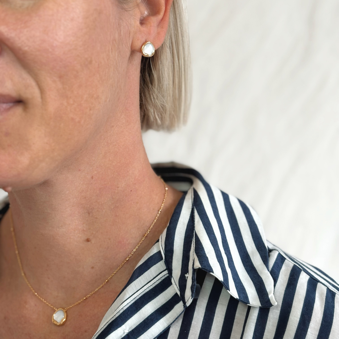 Simple yet striking, the Kiara Studs feature uniquely shaped white Mother of Pearl set in yellow gold-plated sterling silver. Their soft iridescence and modern silhouette make them a versatile choice for everyday elegance or effortless layering with your other favourites.
