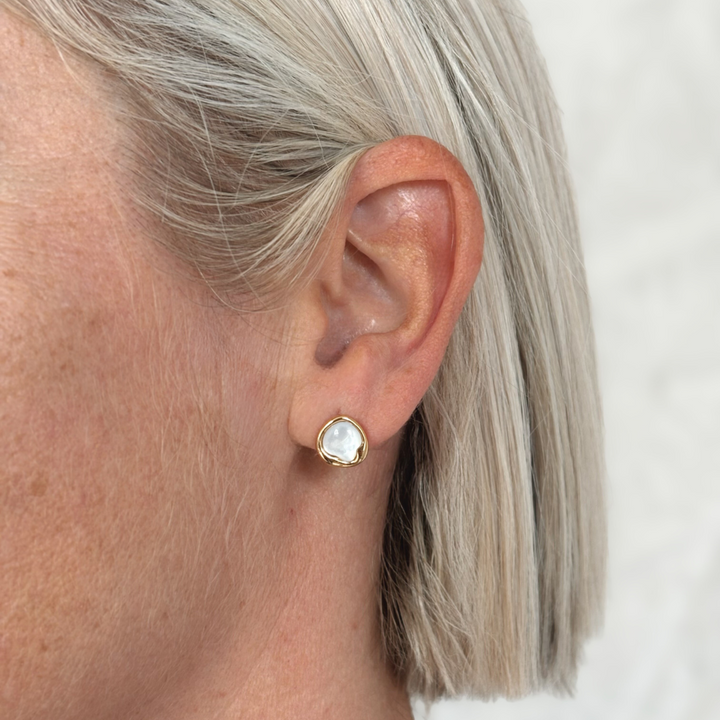 Simple yet striking, the Kiara Studs feature uniquely shaped white Mother of Pearl set in yellow gold-plated sterling silver. Their soft iridescence and modern silhouette make them a versatile choice for everyday elegance or effortless layering with your other favourites.