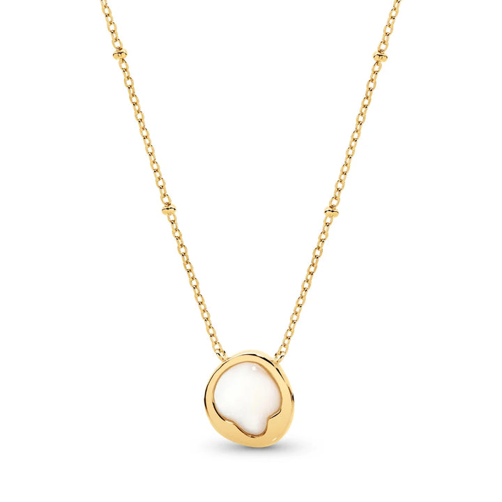 Elegant and effortless, the Kiara Necklace features a uniquely shaped white Mother of Pearl pendant set in yellow gold-plated sterling silver. Suspended on a chain, this piece brings a soft, luminous glow to any neckline — perfect for layering or wearing solo as a subtle statement.