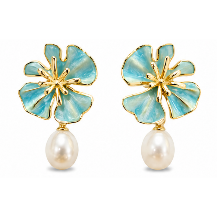 The Posie Earrings are a joyful expression of colour and craftsmanship, crafted in sterling silver with warm yellow gold plating and finished with delicate enamel petals in a soft blush or blue tone. Inspired by blooming florals, each earring is accented with a luminous white freshwater pearl that catches the light with a gentle, natural glow. The combination of soft colour, golden warmth, and organic form creates a look that feels both playful and refined, balancing timeless pearl elegance with a fresh, mo