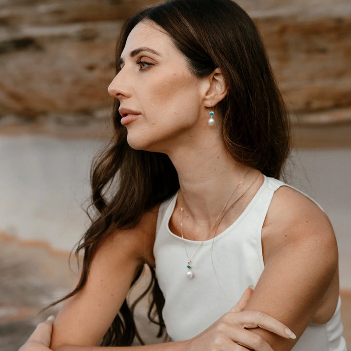 Enhance your wardrobe with a touch of individuality by choosing our light opal pendant, crafted in either 9ct yellow gold or sterling silver. Named in honour of one of Australia&