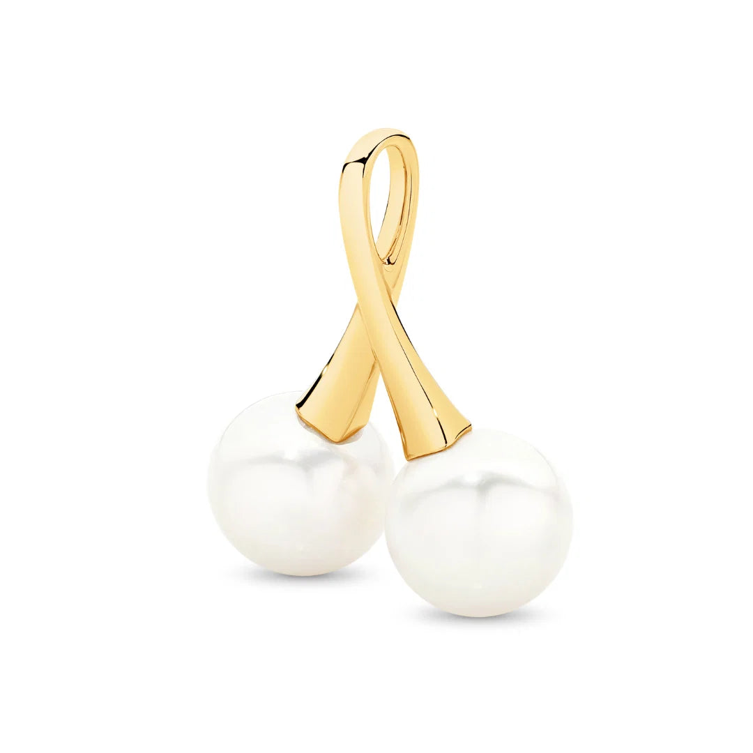 A statement in refined elegance, the Juniper Pendant features two luminous Edison freshwater pearls, beautifully set in 9ct yellow gold. With its double-drop design and radiant finish, this pendant is a timeless expression of sophistication — perfect for marking a special occasion or elevating everyday wear.