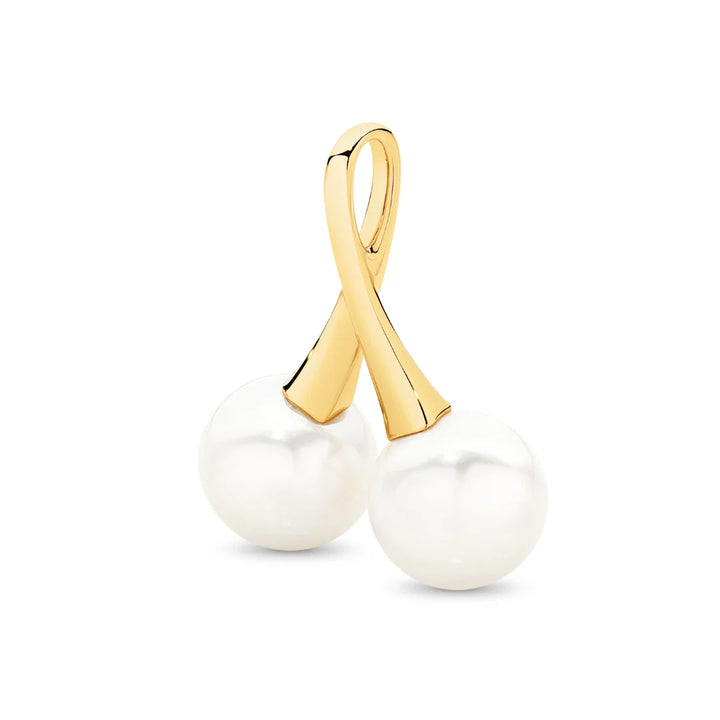 A statement in refined elegance, the Juniper Pendant features two luminous Edison freshwater pearls, beautifully set in 9ct yellow gold. With its double-drop design and radiant finish, this pendant is a timeless expression of sophistication — perfect for marking a special occasion or elevating everyday wear.