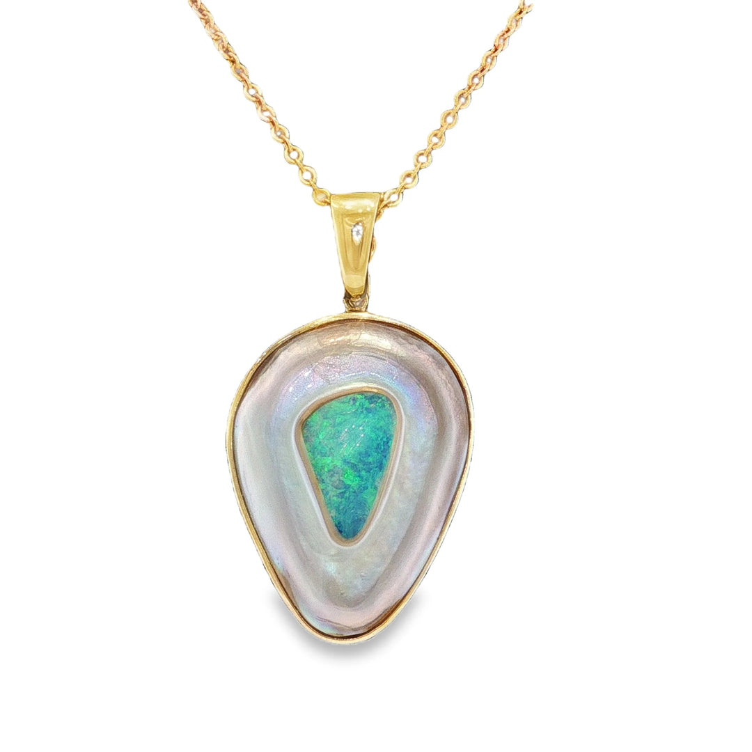 Discover this stunning piece from the Earth+Ocean Jewellery collection, featuring a unique Solid Opal and South Sea Mabe Pearl. Each piece showcases a natural fusion of opal encased in nacre layers by a Batwing Oyster, creating a one-of-a-kind treasure. This collection captures the essence of natural beauty, offering exclusive jewellery that seamlessly blends oceanic and earthy elements through a remarkable natural process.
