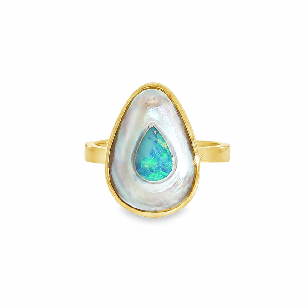 Discover this stunning piece from the Earth+Ocean Jewellery collection, featuring a unique Solid Opal and South Sea Mabe Pearl. Each piece showcases a natural fusion of opal encased in nacre layers by a Batwing Oyster, creating a one-of-a-kind treasure. This collection captures the essence of natural beauty, offering exclusive jewellery that seamlessly blends oceanic and earthy elements through a remarkable natural process.
