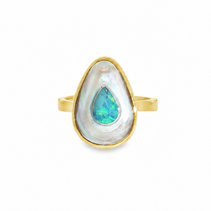 Discover this stunning piece from the Earth+Ocean Jewellery collection, featuring a unique Solid Opal and South Sea Mabe Pearl. Each piece showcases a natural fusion of opal encased in nacre layers by a Batwing Oyster, creating a one-of-a-kind treasure. This collection captures the essence of natural beauty, offering exclusive jewellery that seamlessly blends oceanic and earthy elements through a remarkable natural process.