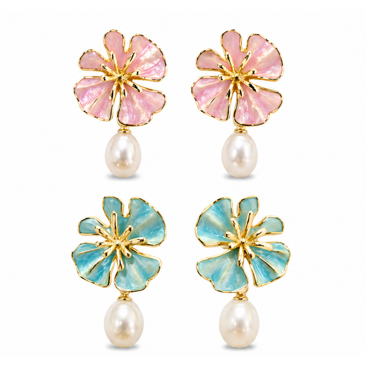The Posie Earrings are a joyful expression of colour and craftsmanship, crafted in sterling silver with warm yellow gold plating and finished with delicate enamel petals in a soft blush or blue tone. Inspired by blooming florals, each earring is accented with a luminous white freshwater pearl that catches the light with a gentle, natural glow. The combination of soft colour, golden warmth, and organic form creates a look that feels both playful and refined, balancing timeless pearl elegance with a fresh, mo