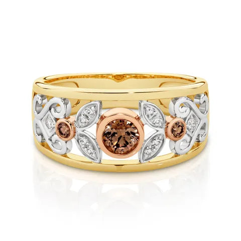 nspired by nature, the Wild Daisy Ring in 9ct yellow, white and rose gold features a warm 0.30ct Australian Chocolate Diamond at its centre, highlighted by a rose gold bezel. Surrounding petals of white round brilliant cut diamonds, set in white gold, add beautiful sparkle and contrast. The design is finished with yellow gold rails, creating a timeless celebration of Australian beauty and individuality.